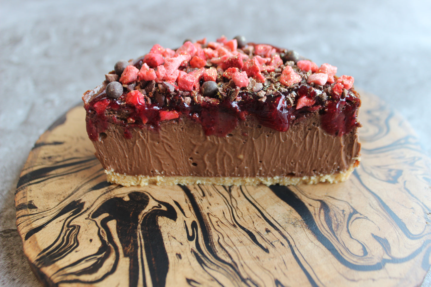 Chocolate Cheesecake with Toppings : raspberry gel , freeze-dried raspberry, cocoa nibs and cocoa pearls.